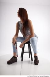 MOLLY SITTING POSE WITH GUN 2